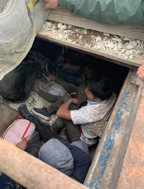 Laredo Sector Border Patrol agents find 30 migrants from Ecuador and Mexico trapped in a false bottom of a dump truck. (Photo: Laredo Sector/U.S. Border Patrol)
