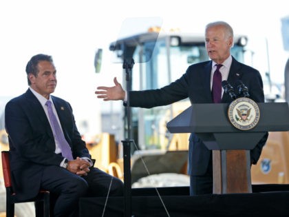While New York Gov. Andrew Cuomo, left, looks on, Vice President Joe Biden speaks during a news conference at LaGuardia Airport in New York, Tuesday, June 14, 2016. Cuomo and Biden were helping to announce and break ground on major infrastructure improvements at the airport. (AP Photo/Seth Wenig)
