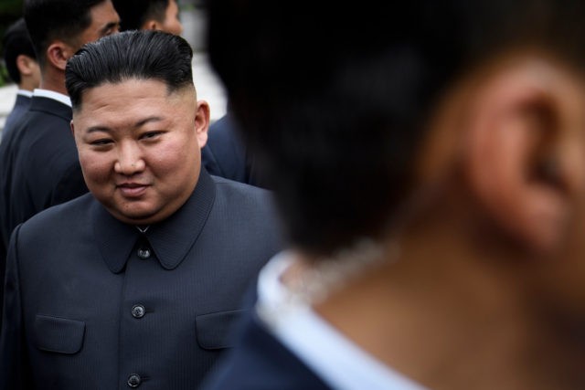 North Korea's leader Kim Jong-un walks to a meeting with US President Donald Trump in the Demilitarized Zone (DMZ) on June 30, 2019, in Panmunjom, Korea. (Photo by Brendan Smialowski / AFP) (Photo credit should read BRENDAN SMIALOWSKI/AFP via Getty Images)