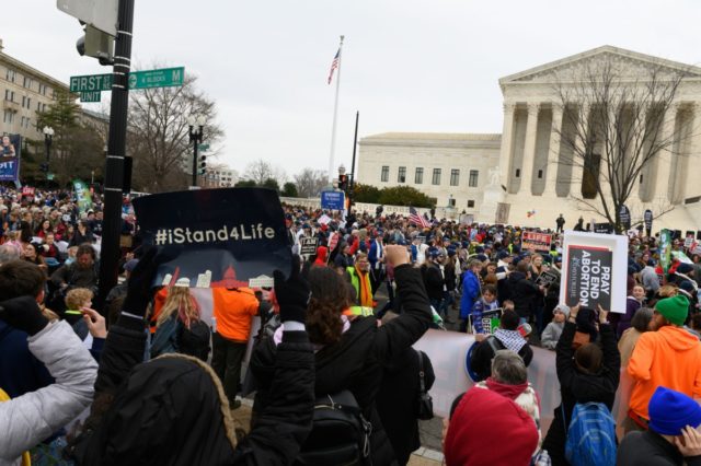 Anti-abortion advocates shout slogans while participating in the 47th annual March For Life in Washington, DC on January 24, 2020. - Activists gathered in the nation's capital for the annual event to mark the anniversary of the Supreme Court Roe v. Wade ruling that legalized abortion in 1973. (Photo by …