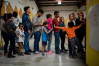 Migrants stand in line Paul Ratje:AFP:Getty Images