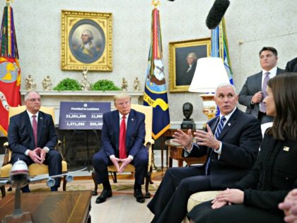 US Vice President Mike Pence speaks during a meeting with US President Donald Trump, Louisiana Governor John Bel Edwards (L) and Dr. Blythe Adamson (R seated), senior quantitative scientist at Flatiron Health, in the Oval Office of the White House in Washington, DC on April 29, 2020. (Photo by MANDEL …
