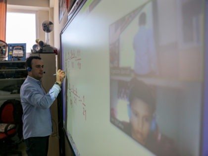 Teacher Egzon Baruti holds an online lesson with his student Ori Bicaku at the International School of Prishtina on Thursday, March 19, 2020. Schools, cafes, restaurants, gyms and pools have been closed, and sports and other entertaining or cultural activities have been suspended, in preventive measures against the spread of …