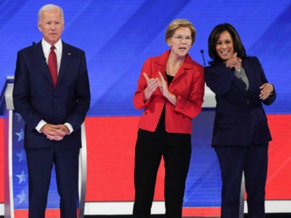 Debate stage--Joe Biden, Elizabeth Warren clapping, and Kamala Harris pointing