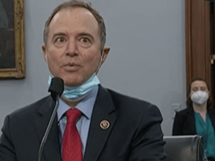 Rep. Adam Schiff wears a mask under his chin during a congressional hearing