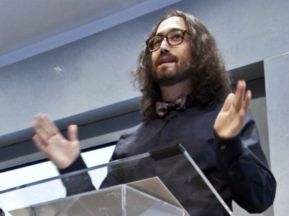 FILE- In this Aug. 29, 2102 file photos, Yoko Ono, left, listens as her son, Sean Lennon,