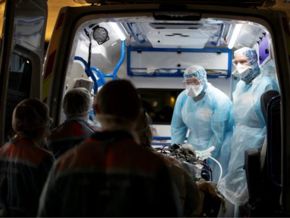 Medical staff disembark from ambulances patients infected with the COVID-19 at the Gare d'Austerlitz train station on April 1, 2020 in Paris as part of the evacuation of 36 patients in two separate medical TGV towards hospitals of Brittany, western France, where the outbreak of the Covid-19 pandemic caused by …