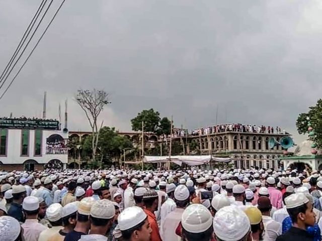 Muslim devotees attend a funeral prayer for an Islamic preacher during a government-imposed nationwide lockdown as a preventive measure against the COVID-19 coronavirus, in Brahmanbaria also known as Sarail on April 18, 2020. - Tens of thousands of people defied a nationwide coronavirus lockdown in Bangladesh on April 18 to …