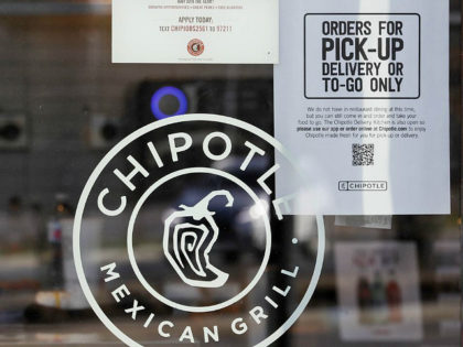 A sign hangs in the window at Chipotle Mexican Grill, Monday, March 16, 2020, in Woodmere Village, Ohio. All bars and restaurants in Ohio will be closed until further notice, said Gov. Mike DeWine, who is taking a tough stance on trying to stem the coronavirus saying "if we don't …