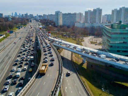 A traffic jam as police check IDs and passes of each person driving into Moscow at a checkpoint at the entrance to Moscow, Russia, Wednesday, April 15, 2020. Traffic jammed up highways leading into Moscow on Wednesday morning after a new system of passes controlling the movement of people within …