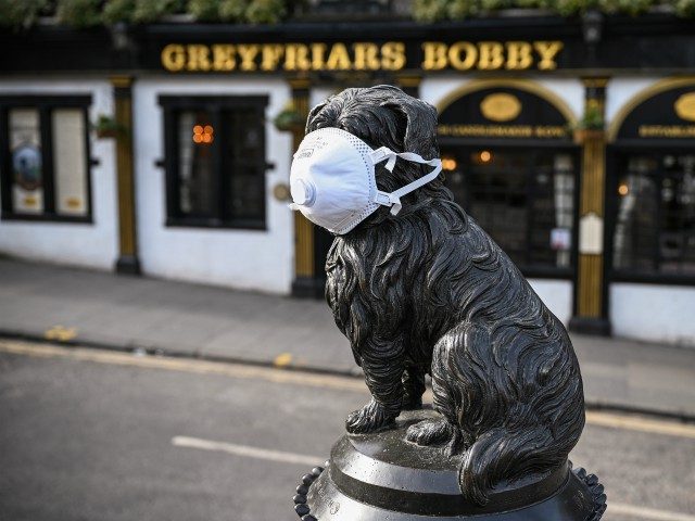 EDINBURGH, SCOTLAND - MARCH 23: Greyfriars Bobby statue has a mask placed on his face on M