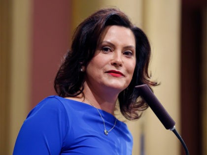 Michigan Gov. Gretchen Whitmer delivers her State of the State address to a joint session of the House and Senate, Tuesday, Feb. 12, 2019, at the state Capitol in Lansing, Mich. (AP Photo/Al Goldis)