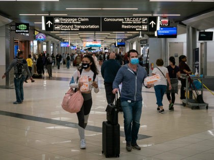 Flyers at Hartsfield-Jackson Atlanta International Airport wearing facemasks on March 6th, 2020 as the COVID-19 coronavirus spreads throughout the United States.