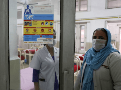 Indian doctors stand inside the special ward set aside for possible COVID-19 patients at a government run hospital in Jammu, India, Friday, March 6, 2020. For weeks India watched as COVID-19 spread in neighboring China and other countries as its own caseload remained static. But with the virus now spreading …