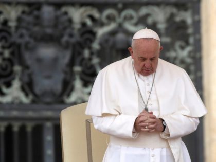 Pope Francis prays in St. Peter's Square at the Vatican during his weekly general audience
