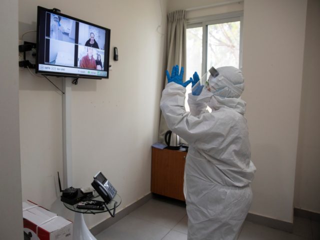 Israeli Professor Galia Rahavm, head of infectious diseases, shows one of the rooms where