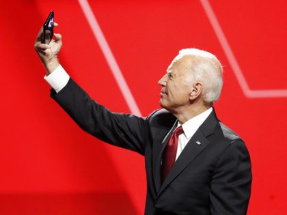 Democratic presidential candidate former Vice President Joe Biden takes a photo following