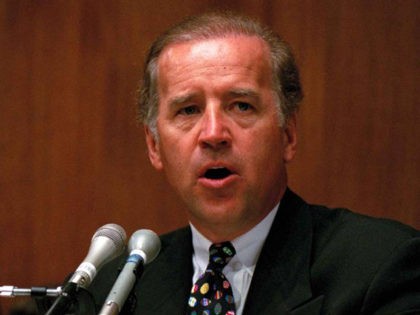 Sen. Joe Biden (D-Del.), chairman of the Senate Judiciary Committee, holds a copy of "Catalogue of Hope: Crime Prevention Programs for At-Risk Children" during a hearing of the committee on Capitol Hill, April 26, 1994. the committee was holding hearings on crime prevention, focusing on protecting disadvantaged children. (AP Photo/John …