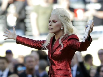 Lady Gaga sings the national anthem before the NFL Super Bowl 50 football game between the