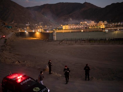 Police stand guard outside Castro Castro prison during a riot, in Lima, Peru, Monday, April 27, 2020. Peru's prison agency reported that three prisoners died from causes still under investigation after a riot at the Miguel Castro Castro prison in Lima. Inmates complain authorities are not doing enough to prevent …
