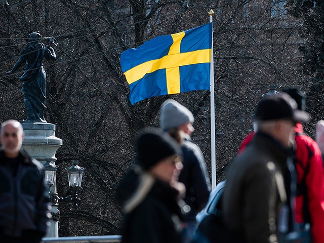 The Swedish flag is pictured on April 4, 2020 in Stockholm during the the new coronavirus COVID-19 pamdemic. (Photo by Jonathan NACKSTRAND / AFP) (Photo by JONATHAN NACKSTRAND/AFP via Getty Images)