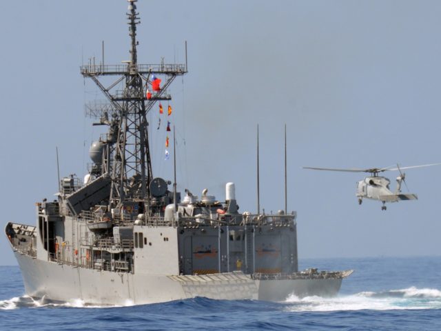 A US-made 70-C helicopter lands on a Perry-class frigate during the Han Kuang drill on the sea near eastern Hualien on September 17, 2014. Taiwanese navy fired rockets and guns on September 17 in a scenario simulating a Chinese invasion in the island's biggest live-fire naval drill in 25 years. …