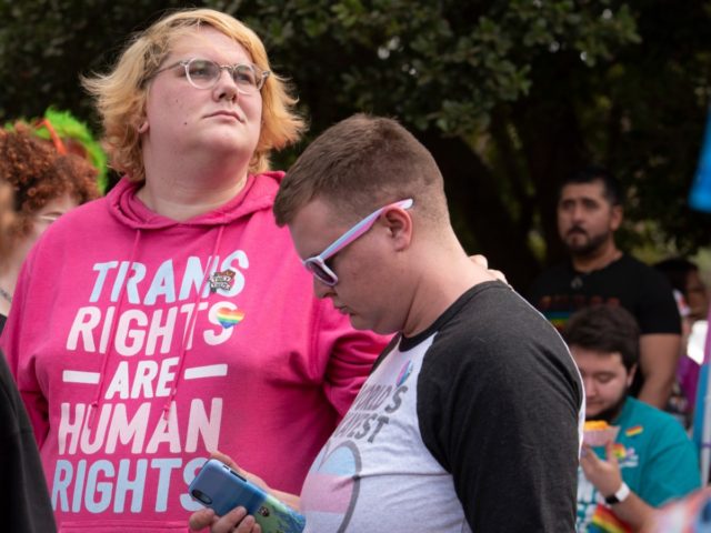 Members of the area's transgender and non-binary community gather for a transgender rights march through the city's Midtown district in Atlanta on Saturday, Oct. 12, 2019. The march was part of the annual Gay Pride Festival. (AP Photo/Robin Rayne)