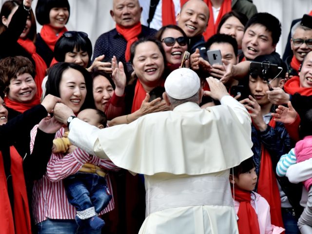 TOPSHOT - Pope Francis greets faithful from China as he arrives for his weekly general audience on April 18, 2018, on St. Peter's square in the Vatican. (Photo by TIZIANA FABI / AFP) (Photo credit should read TIZIANA FABI/AFP via Getty Images)