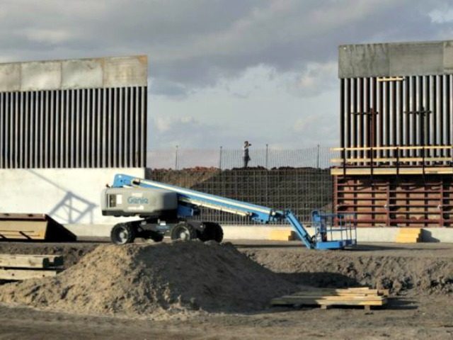 In this Nov. 7, 2019, file photo, the first panels of levee border wall are seen at a cons