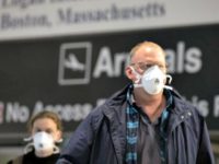 Passengers on a flight from Paris arrive at Logan International Airport in Boston, Friday, March, 13, 2020. Beginning at midnight Friday most Europeans will be banned from entering the United States for 30 days to try to slow down the spread of the coronavirus. Americans returning from Europe will be …