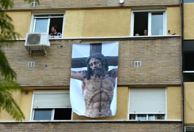 With a nationwide lockdown in place to curb the spread of COVID-19, Spaniards are finding ways to mark Holy Week from their homes © AFP CRISTINA QUICLER