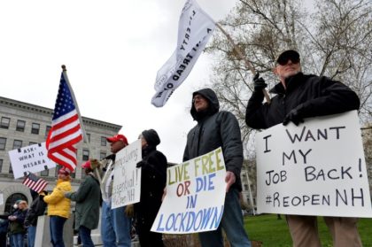 Hundreds of New Hampshire residents rallied outside the statehouse in Concord on April 18, 2020 to urge a quick end to the northeastern state's virus-related stay-at-home rule; similar protests have spread across the country Hundreds protest against US virus rules amid spreading resentment