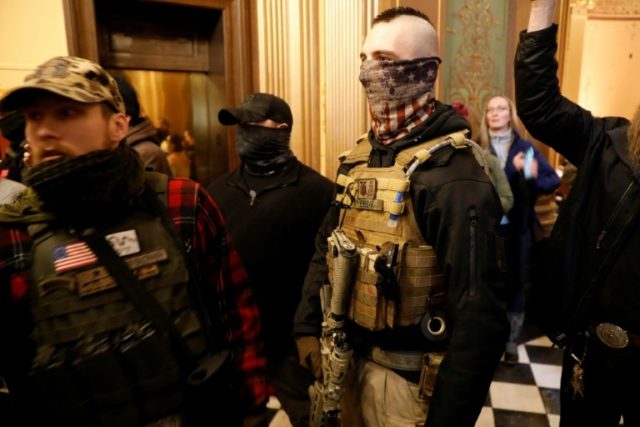 Armed US Protesters Enter Michigan Capitol to Demand ...