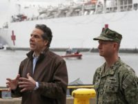 New York Go. Andrew Cuomo, left, speaks as he stands beside Rear Adm. John B. Mustin after the arrival of the USNS Comfort, a naval hospital ship with a 1,000 bed-capacity, Monday, March 30, 2020, at Pier 90 in New York. The ship will be used to treat New Yorkers …