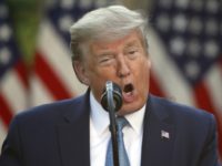 In this April 15, 2020, photo, President Donald Trump speaks about the coronavirus in the Rose Garden of the White House in Washington. President Donald Trump’s well-known disdain for foreign aid is colliding with the imperatives of fighting the coronavirus pandemic, as his administration boasts about America’s generosity for countries …
