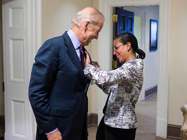 National Security Advisor Susan E. Rice helps Vice President Joe Biden with a spot on his