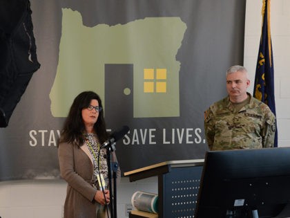 Akiko Saito with the Oregon Health Authority (OHA) and Brig. Gen. William J. Prendergast,