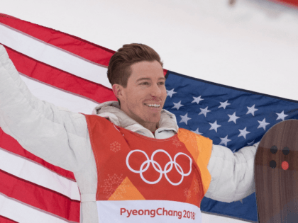 Shaun White, of the United States, celebrates his gold medal win in snowboard halfpipe at