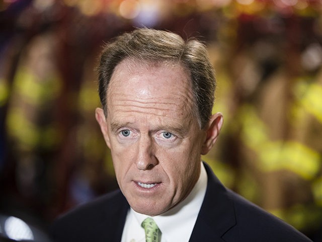 Sen. Pat Toomey, R-Pa., speaks speaks with members of the media at the Monroe Energy Trainer Refinery in Trainer, Pa., Monday, July 29, 2019. (AP Photo/Matt Rourke)