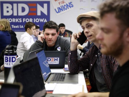 Volunteers call potential caucus-goers at a campaign field office for Democratic presidential candidate former Vice President Joe Biden, Monday, Jan. 13, 2020, in Des Moines, Iowa. (AP Photo/Patrick Semansky)