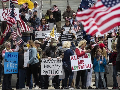 Protesters demonstrate at the state Capitol in Harrisburg, Pa., Monday, April 20, 2020, de