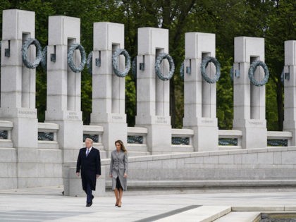 President Donald Trump and first lady Melania Trump visit the World War II Memorial to commemorate the 75th anniversary of Victory in Europe Day, Friday, May 8, 2020, in Washington. (AP Photo/Evan Vucci)