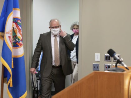 Minnesota Governor Tim Walz arrives to speak at a news conference about the state's response to the coronavirus outbreak Wednesday, May 20, 2020. Restaurants and bars may reopen June 1 for outdoor dining with social distancing and other safeguards in place, while salons and barbershops will also be allowed to …