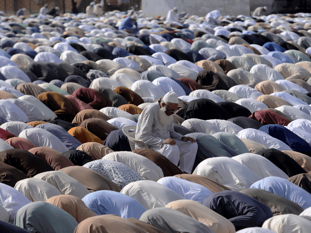 Muslims offer an Eid al-Fitr prayer at a ground in Karachi, Pakistan, Sunday, May 24, 2020. Millions of Muslims across the world are marking a muted and gloomy holiday of Eid al-Fitr, the end of the fasting month of Ramadan - a usually joyous three-day celebration that has been significantly …