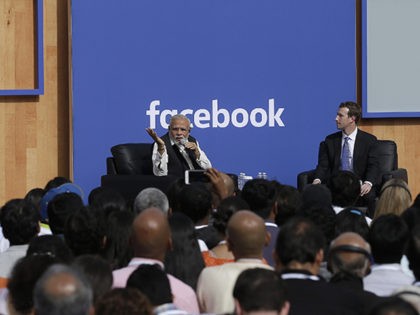 Prime Minister of India Narendra Modi, left, speaks next to Facebook CEO Mark Zuckerberg at Facebook in Menlo Park, Calif., Sunday, Sept. 27, 2015. A rare visit by Indian Prime Minister Narendra Modi this weekend has captivated his extensive fan club in the area and commanded the attention of major …