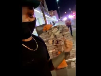 Protest observer notes a random stack of bricks near the Dallas County Courthouse with no construction projects in sight. (Video Screenshot: Ruben Lael)