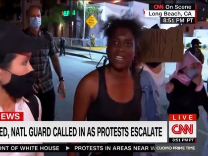 During a Sunday interview with CNN, a protester in Long Beach, CA, delivered a profanity-l