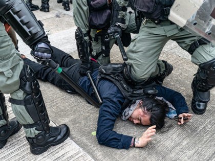 HONG KONG - AUGUST 24: A protester is detained by riot police during an anti-government rally in Kowloon Bay district on August 24, 2019 in Hong Kong, China. Pro-democracy protesters have continued rallies on the streets of Hong Kong against a controversial extradition bill since 9 June as the city …