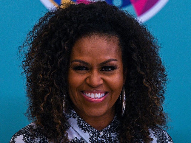 Former US first lady Michelle Obama (C) smiles as she attends a side event for the Obama Foundation in Kuala Lumpur on December 12, 2019. (Photo by Mohd RASFAN / AFP) (Photo by MOHD RASFAN/AFP via Getty Images)