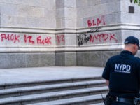 NEW YORK, NEW YORK - MAY 30: An NYPD officer walks by a vandalized St. Patrick's Cathedral on May 30, 2020 in New York City. Minneapolis Police officer Derek Chauvin was filmed kneeling on George Floyd's neck. Floyd was later pronounced dead at a local hospital. Across the country, protests …